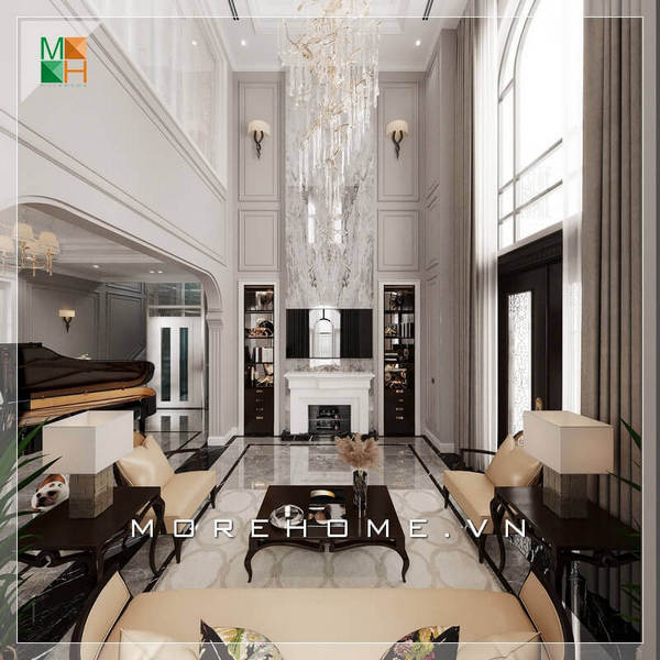 Không gian phòng khách tráng lệ, với mẫu bàn ghế sofa phòng khách sử dụng chất liệu bàn là gỗ tự nhiên cao cấp, ghế sofa bọc da chân ghế sang trọng. Tất cả tạo nên một không gian phòng khách rất hoành tráng và đẳng cấp. Thu hút với mẫu bày trí phòng khách tân cổ điển sang trọng