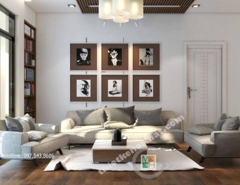 Không còn là những mảng tường đơn sắc thiếu tinh tế, kiến trúc sư lựa chọn trang trí thêm bằng những bức tranh treo tường phòng khách đầy lạ mắt Tranh treo tường phòng khách đẹp, ấn tượng